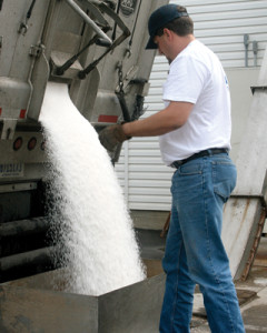 Employee unloading fertilizer, Wilbur-Ellis