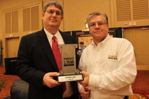 Case IH’s Ken Lehmann, left, receives the 2013 Product of the Year award from CropLife Editor Eric Sfiligoj.