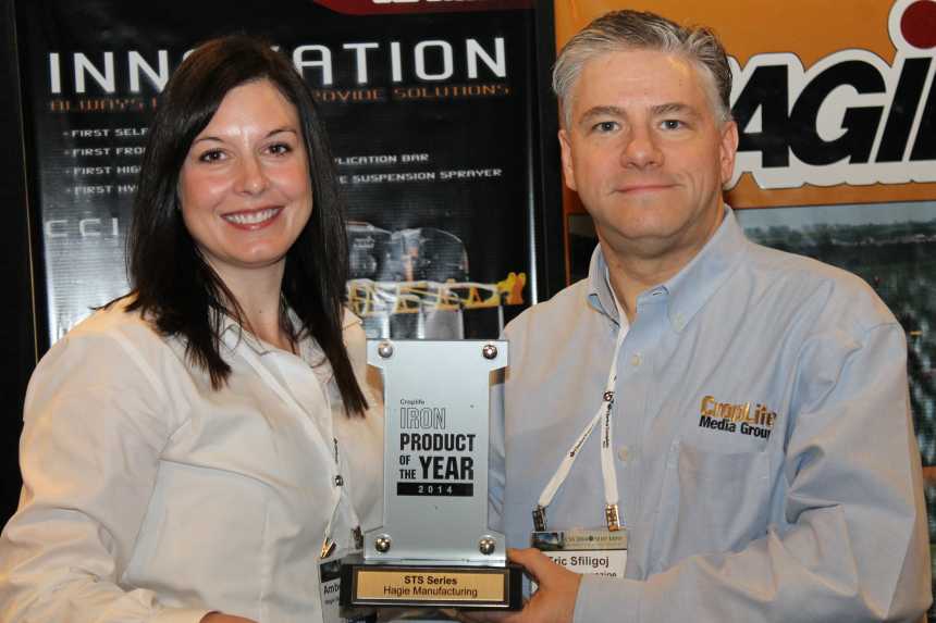 Amber Kohlhaas of Hagie Manufacturing accepts the 2014 CropLife IRON Product Of The Year Award from editor Eric Sfiligoj. Hagie won the award for its 2014 STS Series self-propelled sprayer.