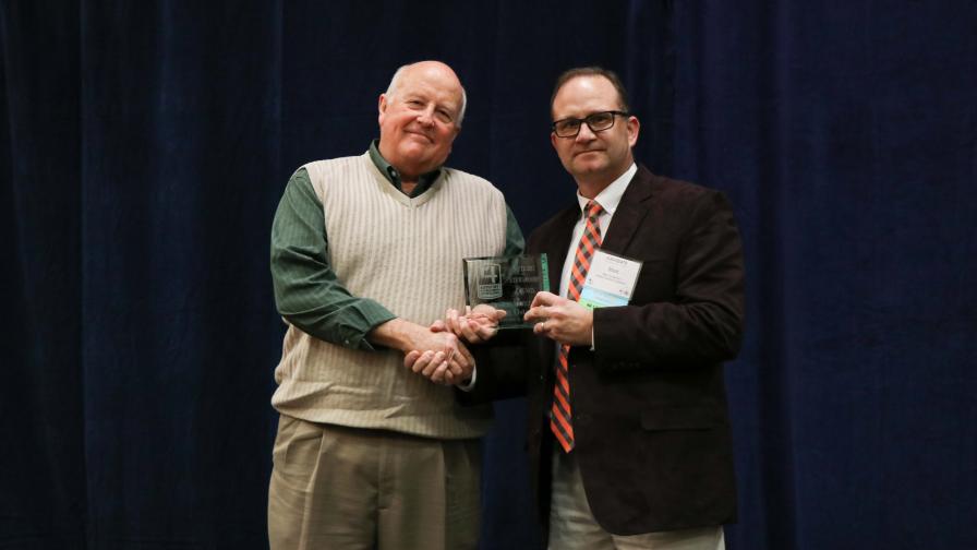 John Oster Receives 2019 Distinguished Service Award